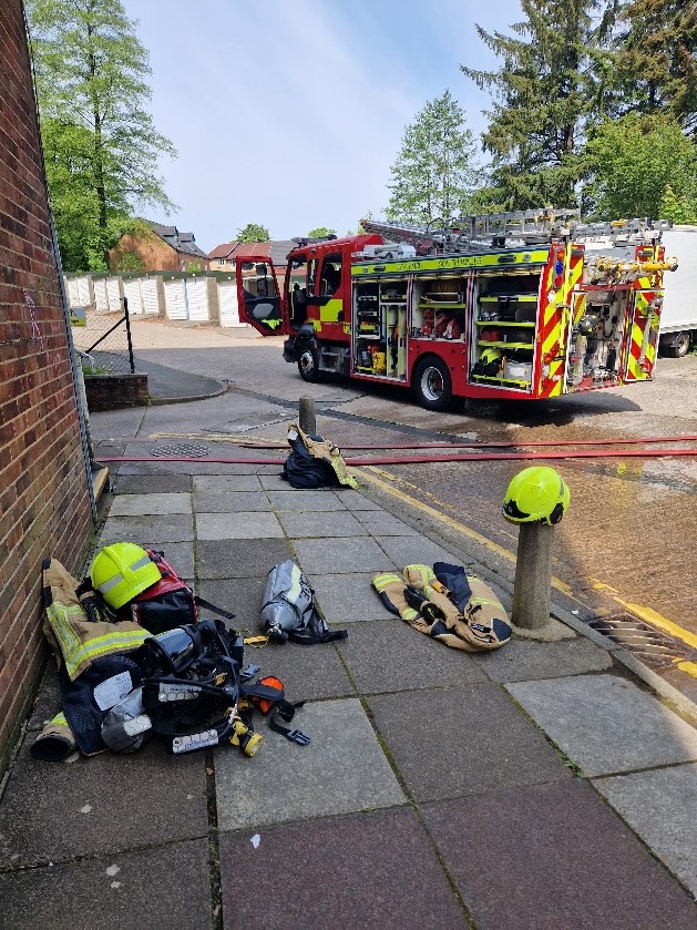 picture of fire crew and their supplies outside block of flats in cardiff