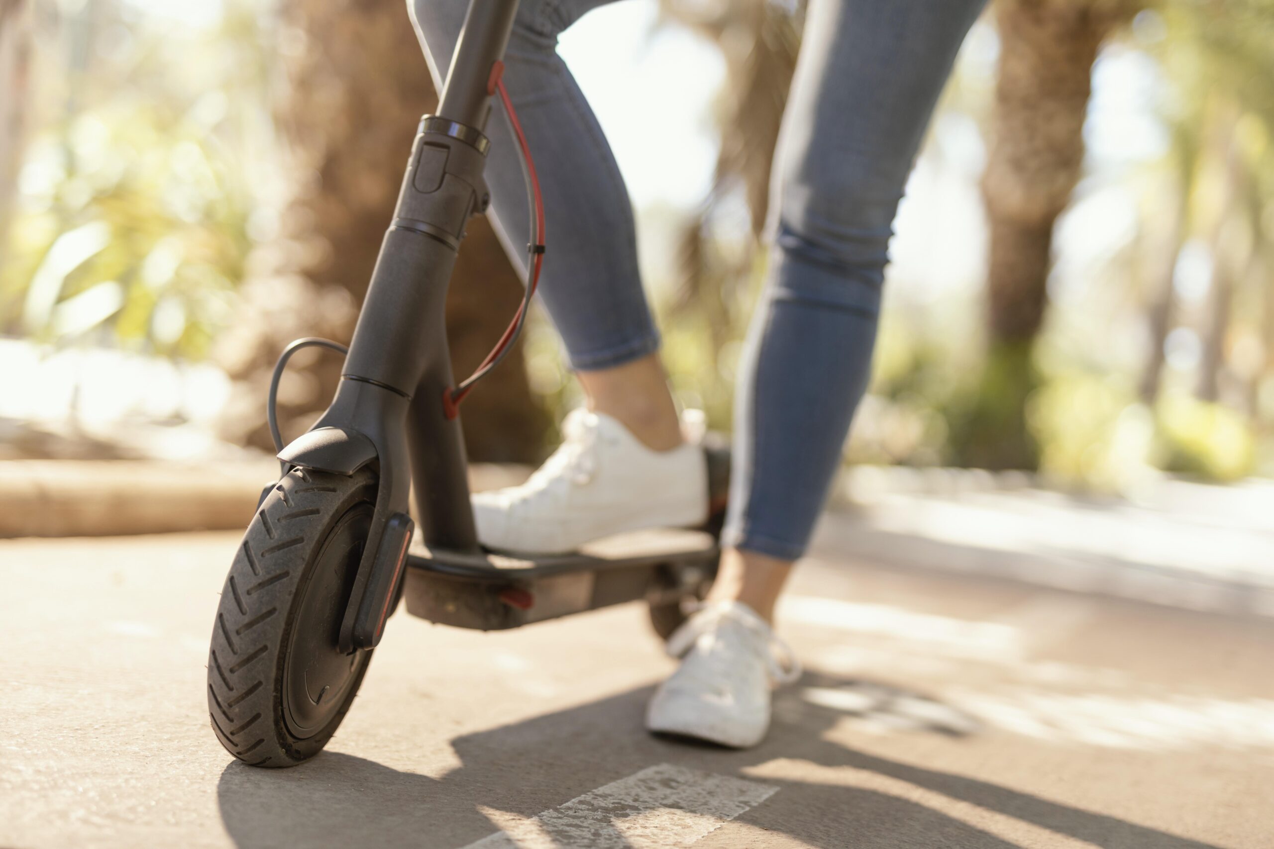 stock image of a girl on an electronic scooter